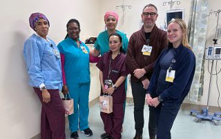 Nurses and doctor smiling
